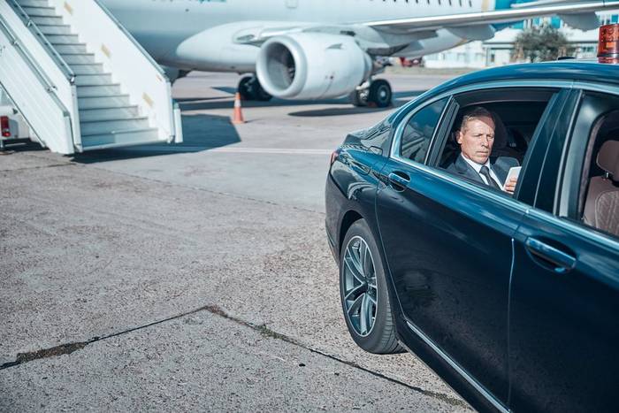 A DG Cars airport transfer waiting at the terminal
