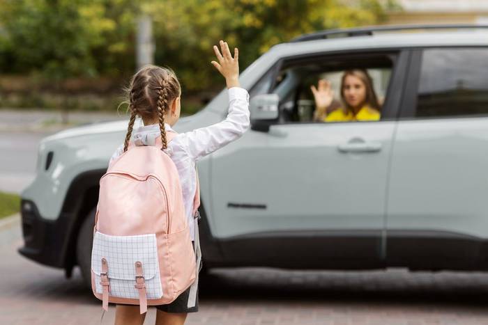 A child being dropped at school by DG Cars